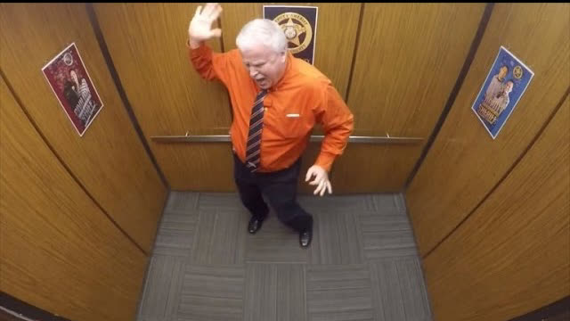 Police officers are caught on camera secretly dancing up a storm in the office elevator…
