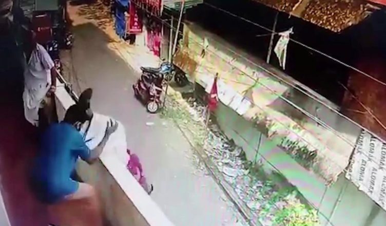 VIDEO: Watch the Lifesaving Moment a Man Topples Backwards Off a Balcony…
